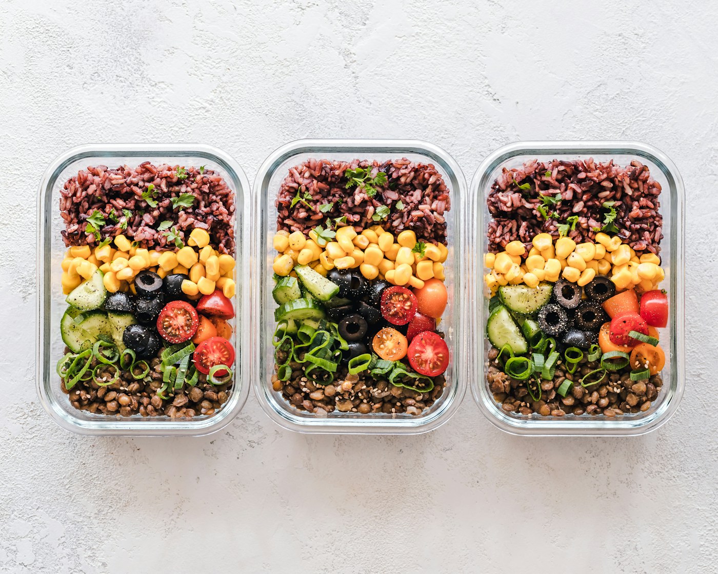 Healthy meal prep bowls with grains, vegetables, and lean protein