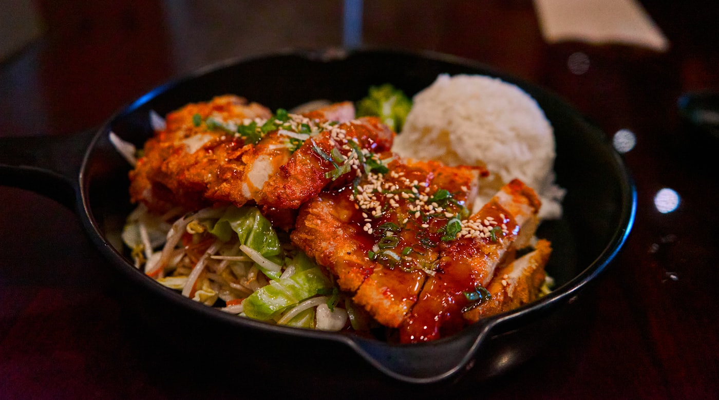 Chicken rice bowl with vegetables and beans for a fitness-style meal