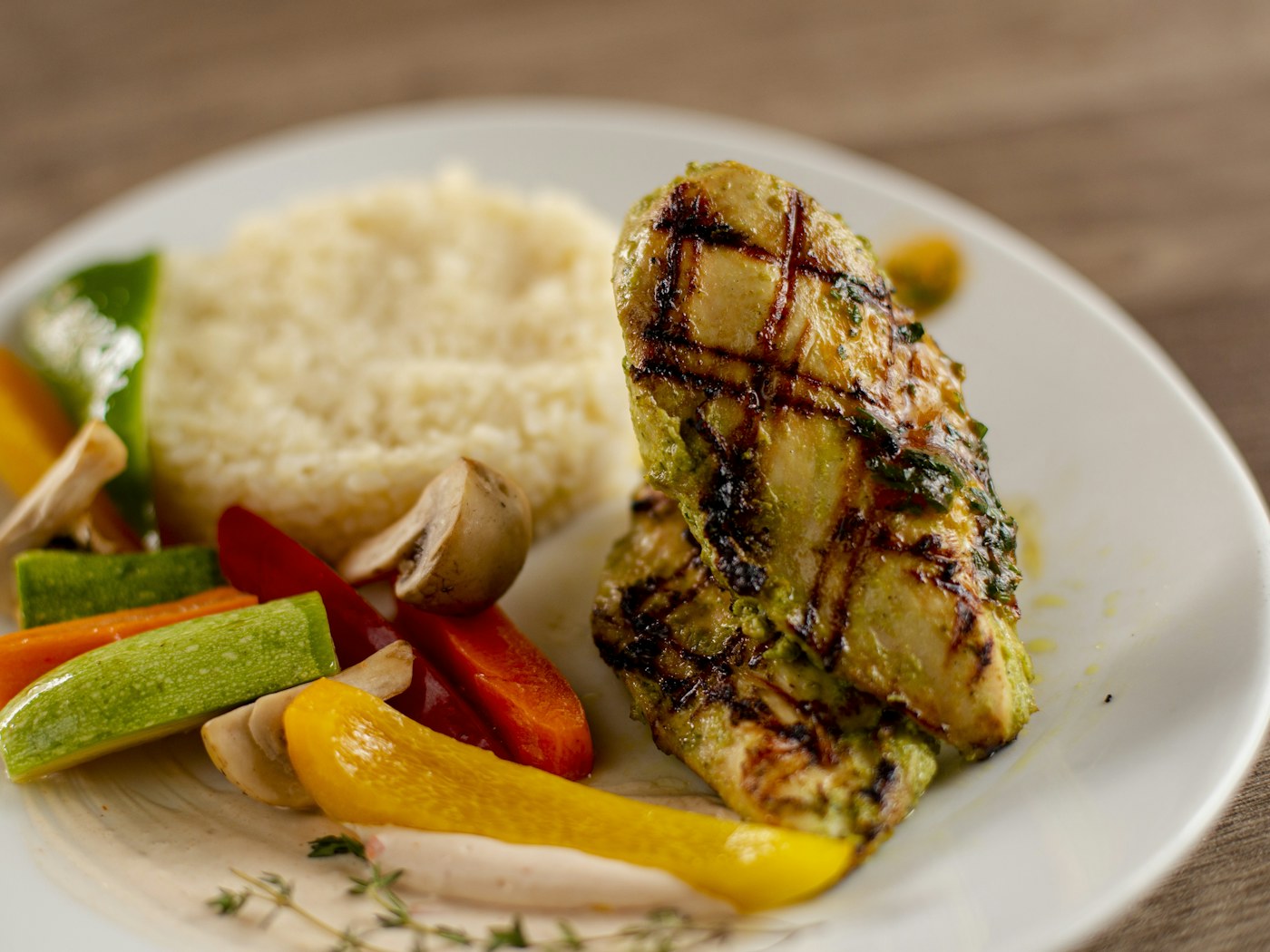 Grilled chicken with rice and vegetables for a balanced workout diet