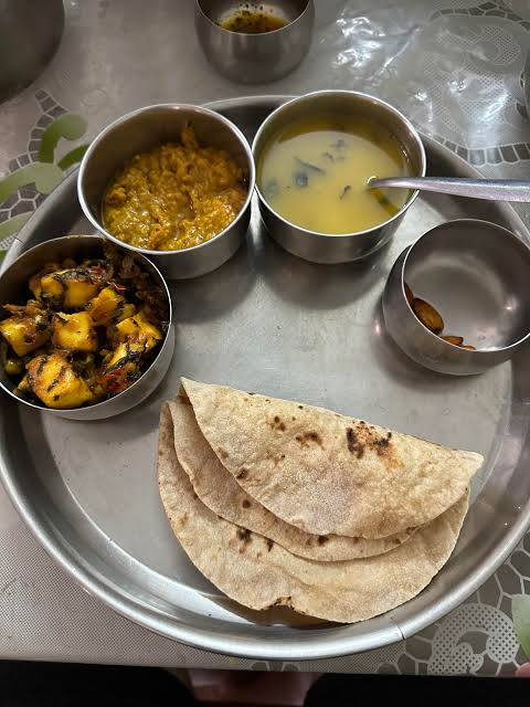 Roti plate with dal, sabji, and curd for a balanced vegetarian meal