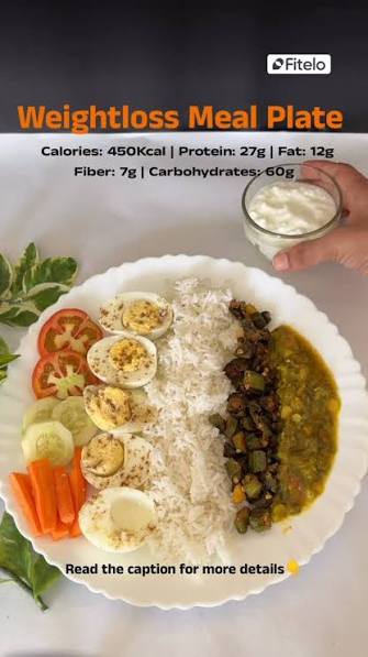 Weight loss meal plate with rice, eggs, dal, vegetables, salad, and curd